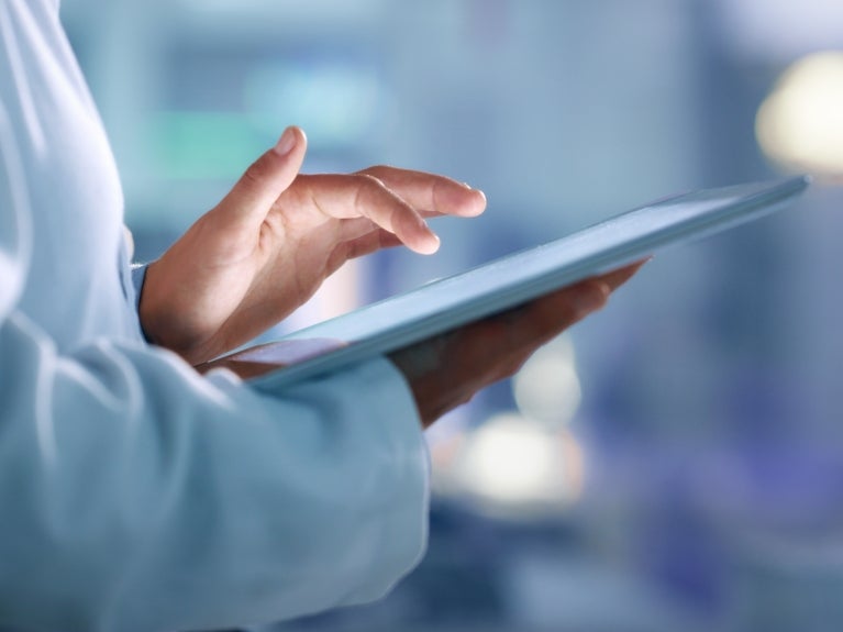 Healthcare, medical provider holding an ipad