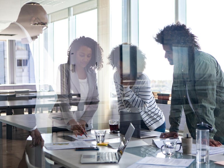 view of people meeting through glass wall