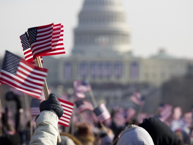 Flags being waved in front of Capital