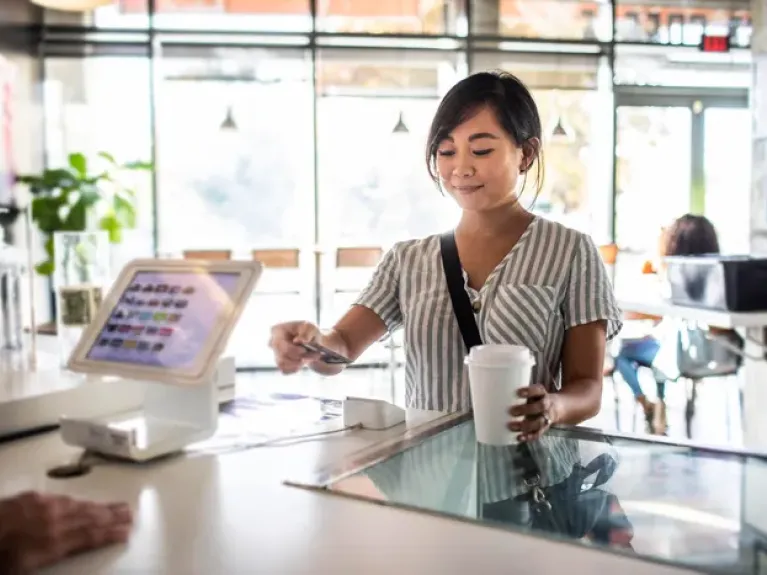 Woman buying cofffee