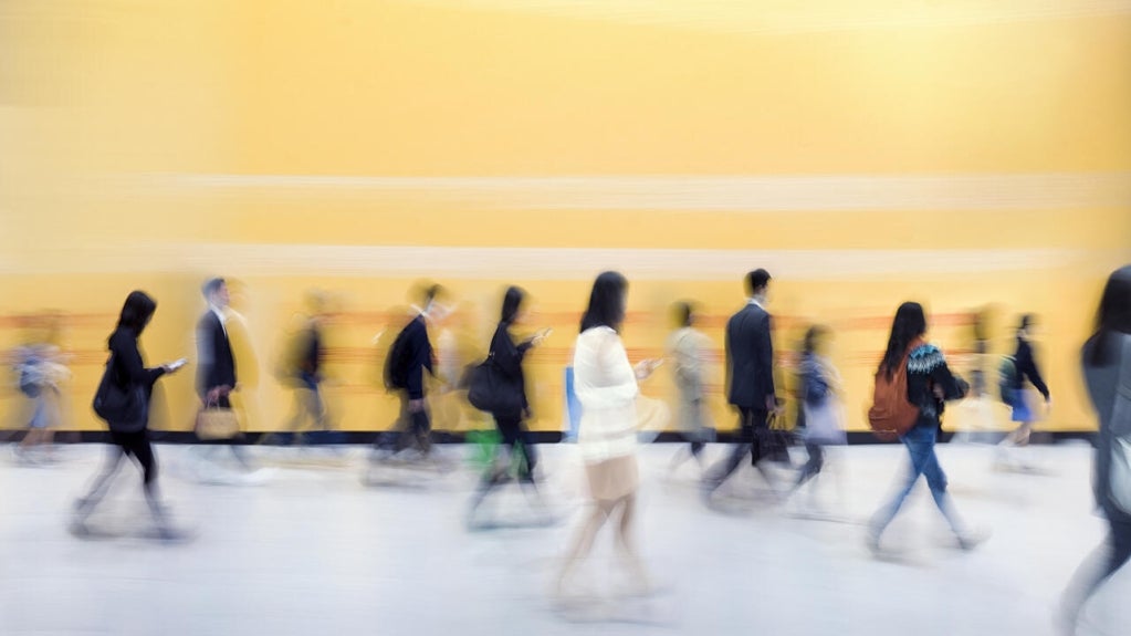 Blurred image of people walking