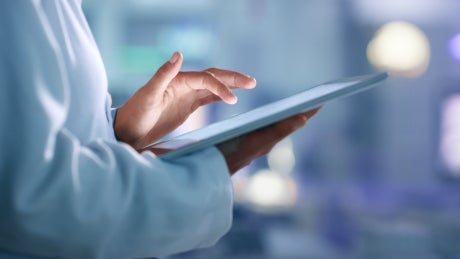 Healthcare, medical provider holding an ipad