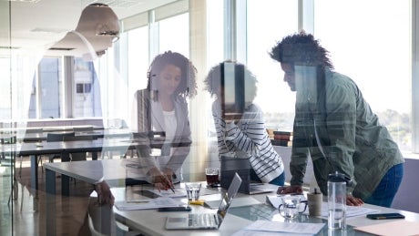 view of people meeting through glass wall