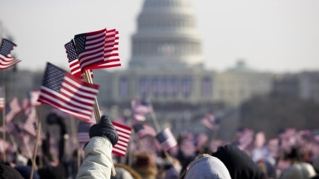 Flags being waved in front of Capital