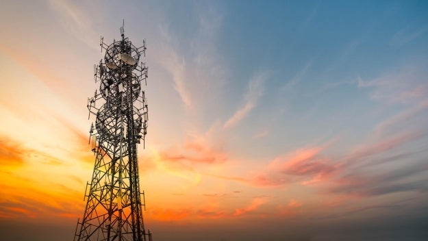 5G Sunset Cell Tower Cellular communications tower for mobile phone and video data transmission