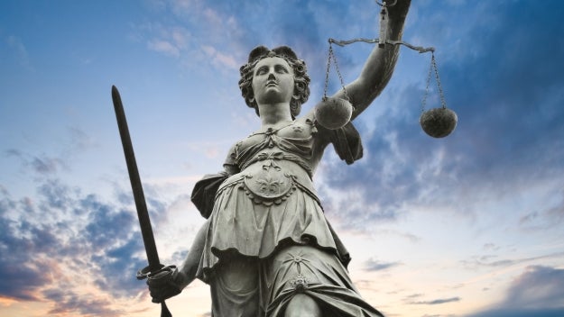 metal justice statue with sky in background in Frankfurt am Main, Germany