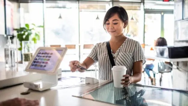 Woman buying cofffee